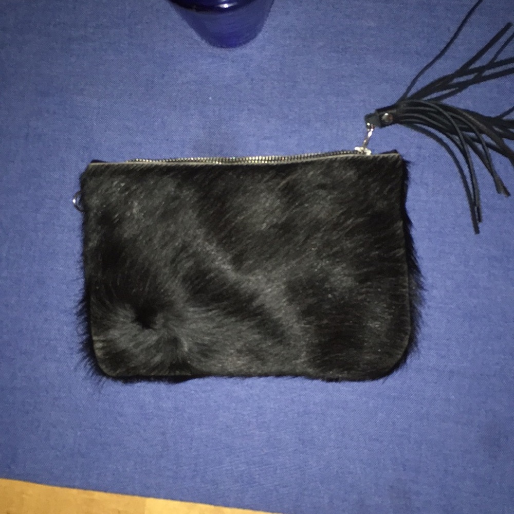 Cow hide lead and tassel clutch